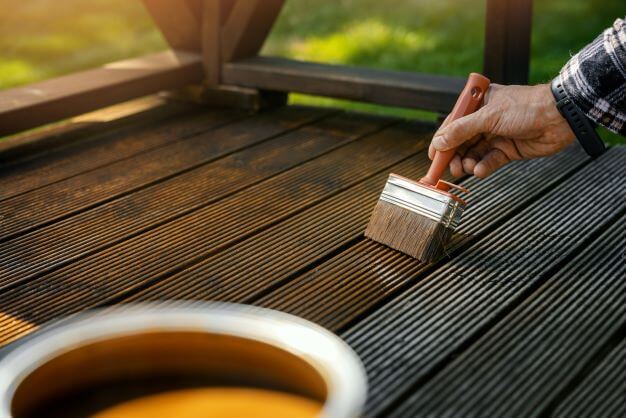 How to Clean and Maintain Decking Decking boards being oiled